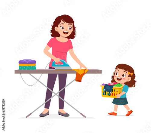 little kid helping mother ironing clean clothes