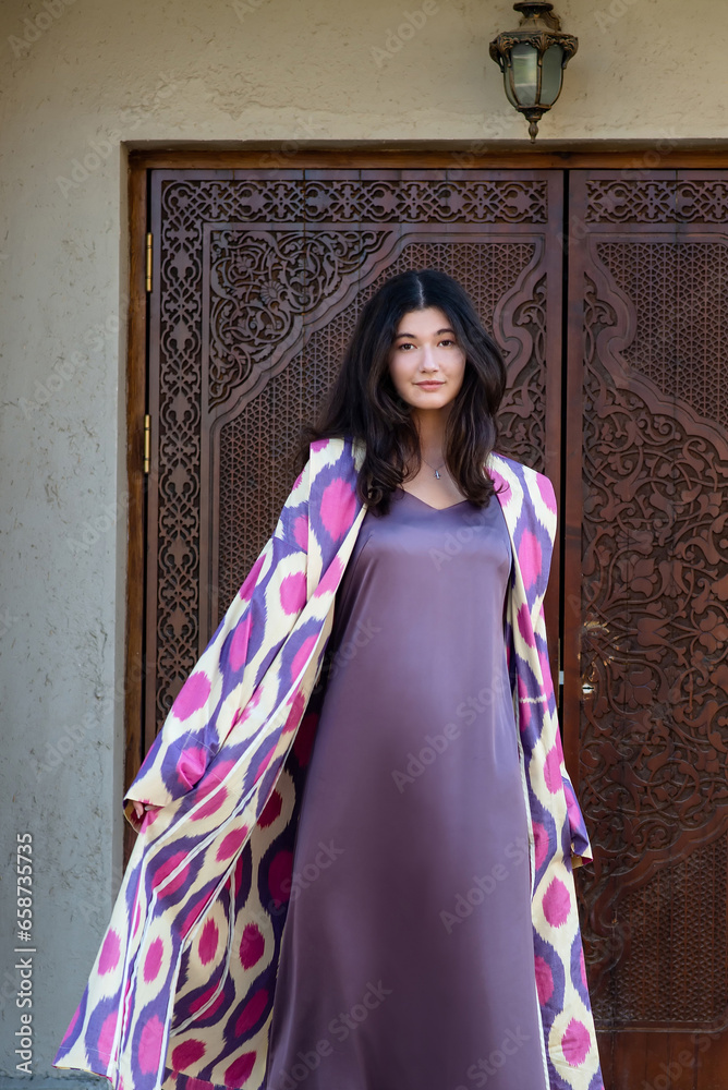 Beautiful fashion model, girl in traditional Uzbekistan fashion dress