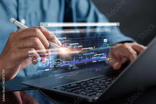 Analyst working with computer in Business Analytics and Data Management System to make report with KPI and metrics connected to database. Corporate strategy for finance, operations, sales, marketing.