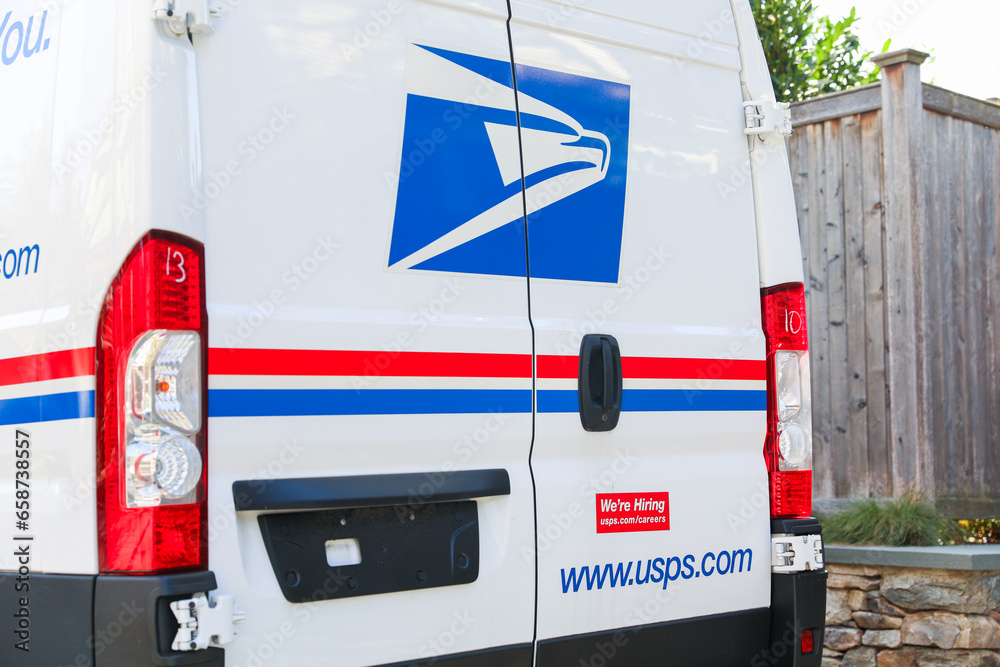 Boston, MA, USA, October, 7th 2023, USPS sign and mailbox and truck on
