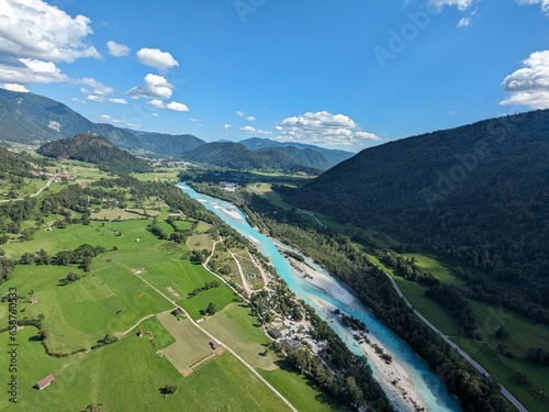 Slovenia Soca river valley Europe,Paragliding beauty of free flying in Julian Alps, big mountains flying at the cloudbase of cumulus clouds,scenic aerial panorama landscape view