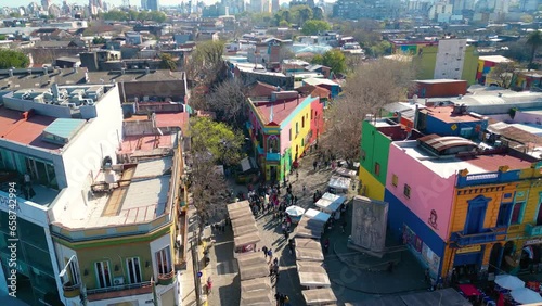 Aerial view of Caminito a famous landmark in La Boca neighborhood in Buenos Aires, Argentina. Drone flying forward
 photo