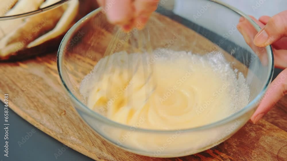 Kneading liqud dough for a pie. Close-up shot of kitchen table. Cooking in the kitchen. Kneading liqud dough for a pie. Close-up shot of kitchen table. Cooking in the kitchen.