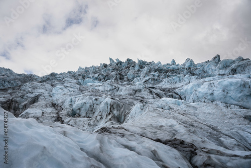 The largest blue cian glacier and its cracks photo