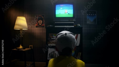 Boy gamer playing games on TV