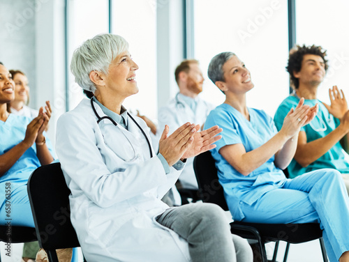 seminar business meeting doctor conference audience presentation education lecture hospital woman elderly senior mature gray hair event training speaker group convention congress speech
