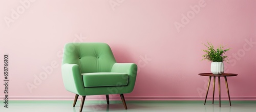 Pink room featuring a green armchair rug and side table With copyspace for text