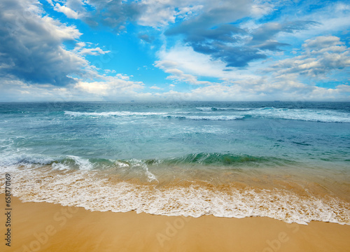 Bright ocean landscape. Sea waves and beautiful sky