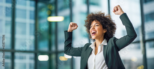 A successful businesswoman with a bright and genuine smile, radiating happiness and confidence in her professional achievements.