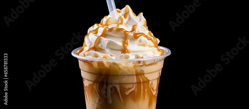 Caramel frappe with whipped cream and dressing in a plastic cup With copyspace for text
