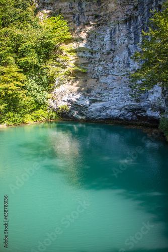 A beautiful blue lake in Abkhazia on a sunny summer day and a space to copy
