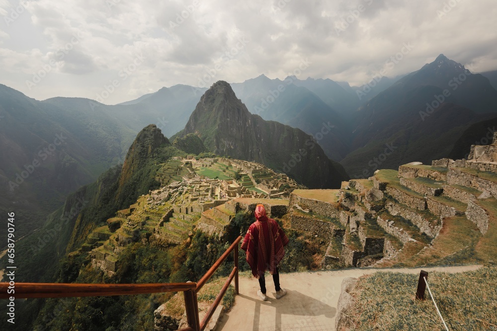 landscape in machupicchu peru with peruvian man in poncho - obrazy, fototapety, plakaty 