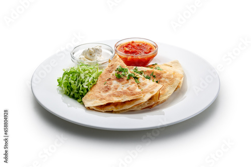 chicken quesadilla with salad and dressings