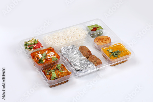 Mini meal or fixed dish which is served by most of restaurants . Panjabi thali . Vegetarian food,Vegetable Gujarati kathiyawadi thali,Traditional Gujarati dishes, dals, sweet, rice and roti