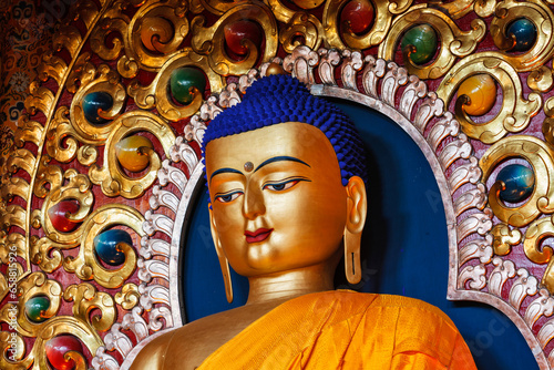 Gilded statue of Sakyamuni Buddha in Tsuglagkhang temple. McLeod Ganj, Himachal Pradesh, India
