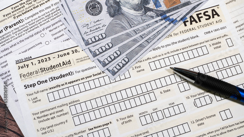 Close up of federal financial aid application with US Cash