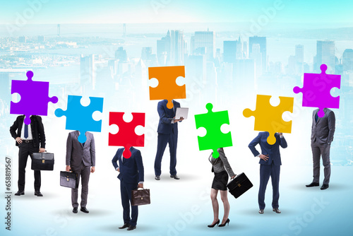 Concept of business people and jigsaw puzzle