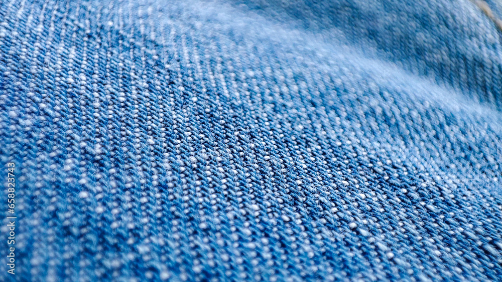 Blue jeans, closeup of the denim material texture. Detailed macro Blue jeans, closeup of the denim material texture. Detailed macro
