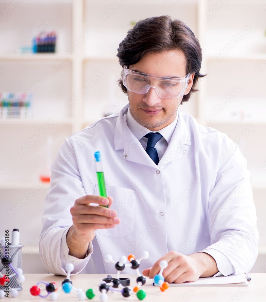 Young male scientist working in the lab Young male scientist working in the lab