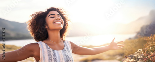 Backlit Portrait of calm happy smiling free black woman with closed eyes enjoys a beautiful moment life on the fields at sunset #658838105