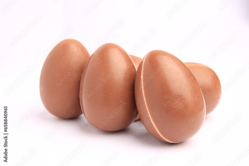Sveti Vlas, Bulgaria - June 27, 2023: Unwrapped Kinder Surprise Eggs isolated on white Sveti Vlas, Bulgaria - June 27, 2023: Unwrapped Kinder Surprise Eggs isolated on white
