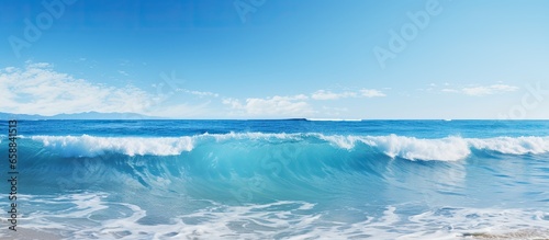 Clear blue sky and waves on blue sea With copyspace for text
