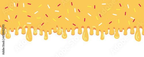 Dripping yellow cream with sprinkles on white background