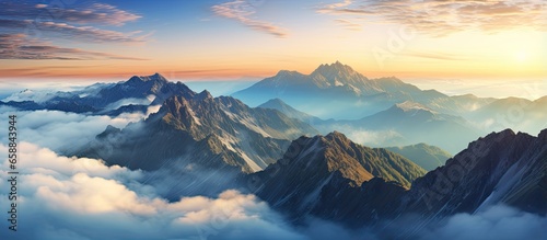 Panoramic sunset above clouds on mountain peak With copyspace for text