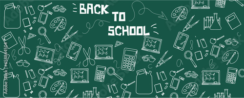Many different drawings and text BACK TO SCHOOL on green chalkboard