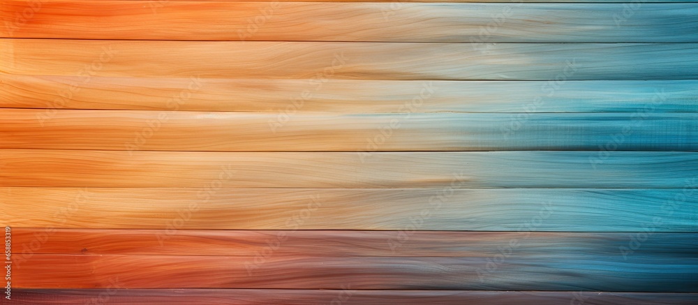 A gradient of colors transitioning from blue to orange on the wood With copyspace for text