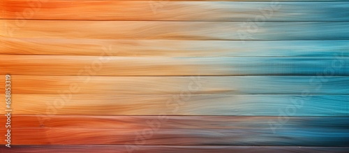 A gradient of colors transitioning from blue to orange on the wood With copyspace for text