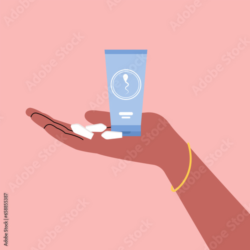 Hand with contraceptive suppositories and spermicide gel on pink background