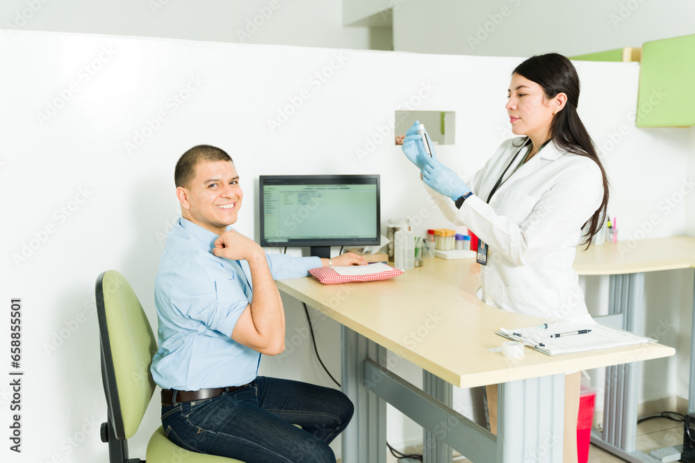 Hispanic patient giving a blood sample for medical exams