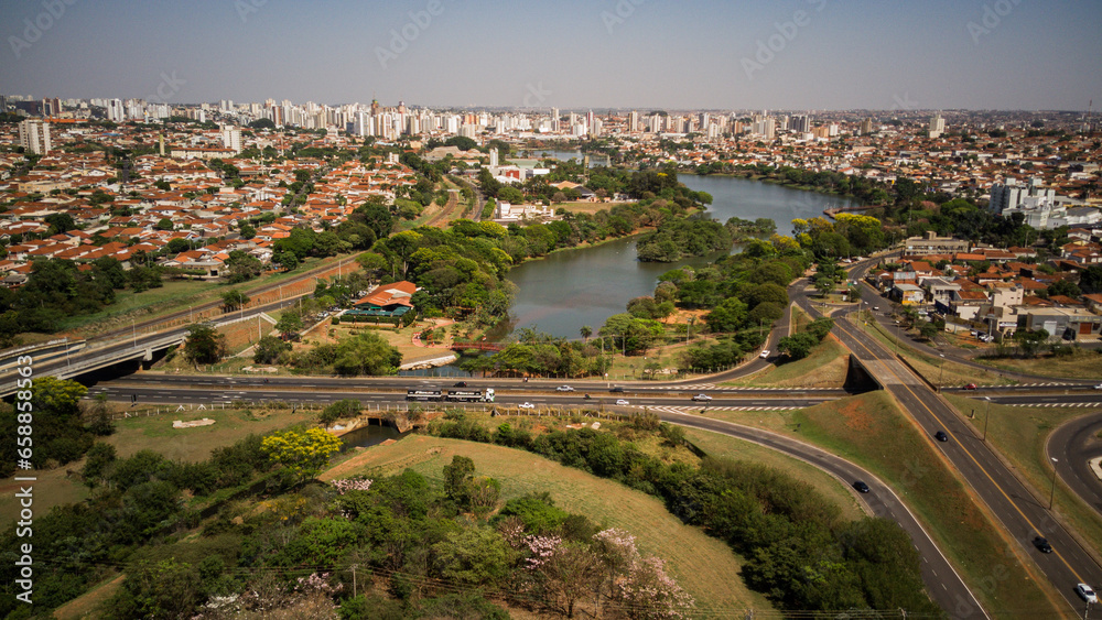 al view of the Rio Preto municipal dam in drone panorama, aerial view on a sunny day with the avenues and highways and the park and the river in high resolution - Sao Jose do Rio Preto - Sao Paulo