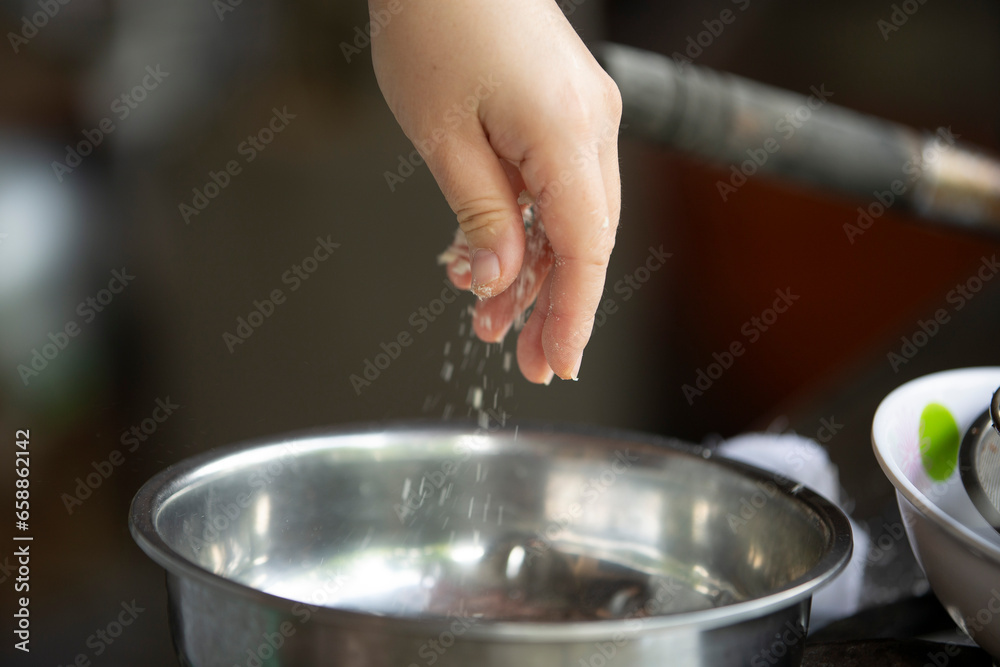 Close up of chef hands cooking in kitchen, shallow depth of field Close up of chef hands cooking in kitchen, shallow depth of field