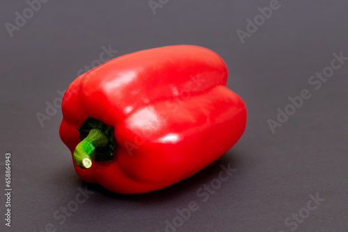 Fresh Red Sweet Bell Pepper on Black Background