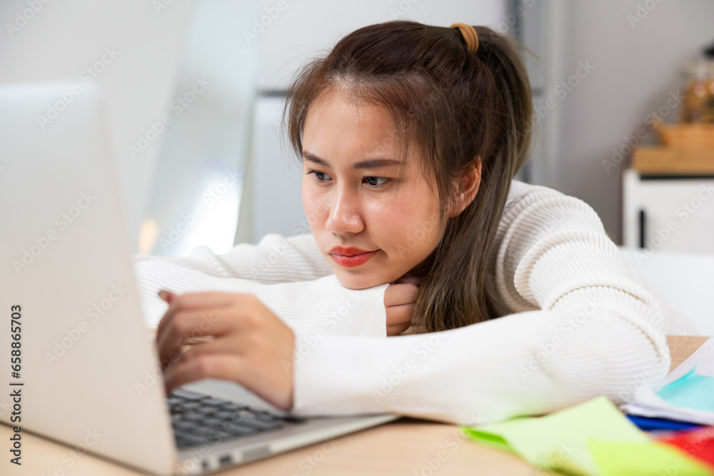 bored Tired exhausted, fatigue and fell asleep. Yaoung asian thai female working on laptop in kitchen room at home. Overwork. Exhausted woman sleeply eye at workplace bored Tired exhausted, fatigue and fell asleep. Yaoung asian thai female working on laptop in kitchen room at home. Overwork. Exhausted woman sleeply eye at workplace