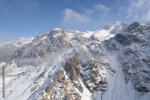 Aerial shot of mountain landscape into the clouds
