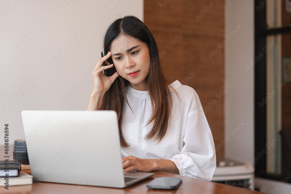 Businesswomen stress and confused while reading finance data to analysis about new startup project Businesswomen stress and confused while reading finance data to analysis about new startup project