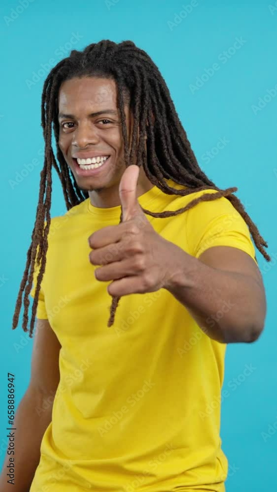 Happy latin man gesturing agreement raising thumbs up Happy latin man gesturing agreement raising thumbs up