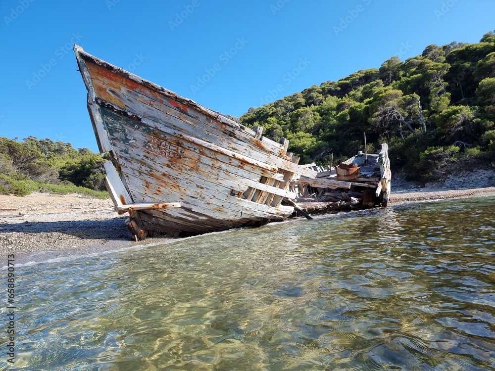 shipwreck on the beach of agalypa of skyros in greece pine trees clear transparent water in the sea