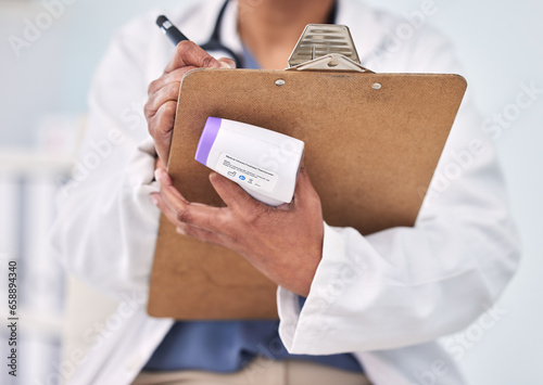 Person, doctor and writing on clipboard for prescription, diagnosis or results with thermometer at hospital. Closeup of medical nurse or surgeon taking notes, temperature or appointment at clinic