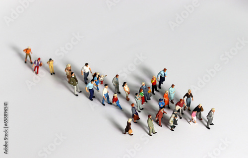 Fototapeta Naklejka Na Ścianę i Meble -  Miniature people and with the of concept Leaders and those who follow them. Various miniature people and business concepts.
