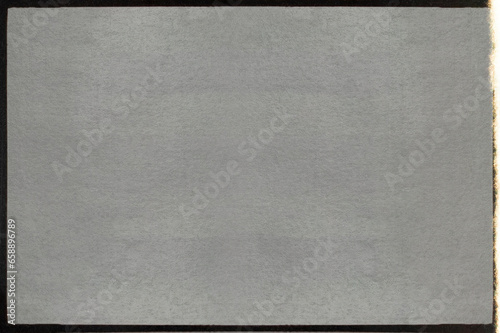 high res scan of empty or blank 16mm film frame with black border and light leak. real cinefilm scan, cool mock up or photo overlay via blend mode. photo