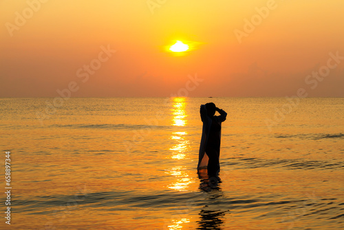Woman pretty with bikini and silhouette on beach