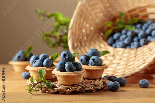 Small tartlets with fresh blueberries and mint.