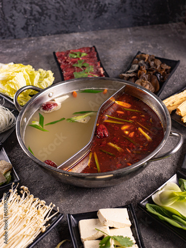 delicious asian bouillon with a lot of extra ingredients. View from above. Chinese cuisine, ingredient for hotpot