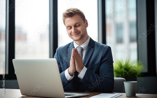 Successful businessman in a suit is sitting and asking for blessings from God in an office