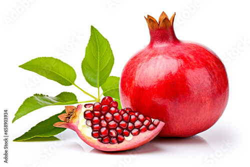 Ripe pomegranate with green leaves isolated on white background
