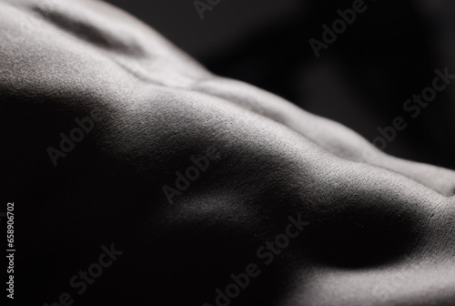Fitness, black man and torso with abdomen in studio for wellness, stomach and body on dark background. Person, muscle and bodybuilder with six pack for healthy lifestyle or strength and closeup